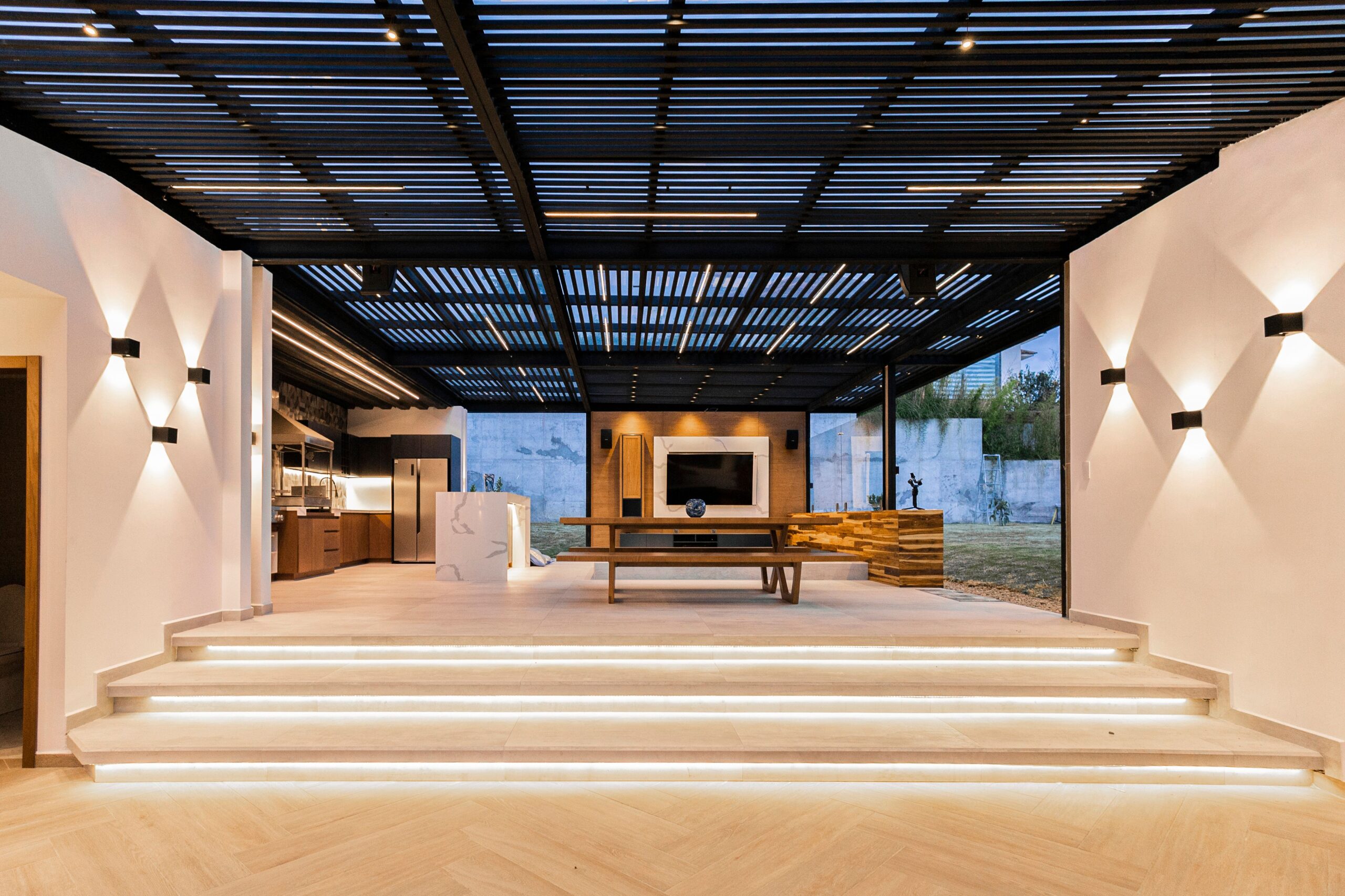 Contemporary open-plan living area with sleek design and minimalism.